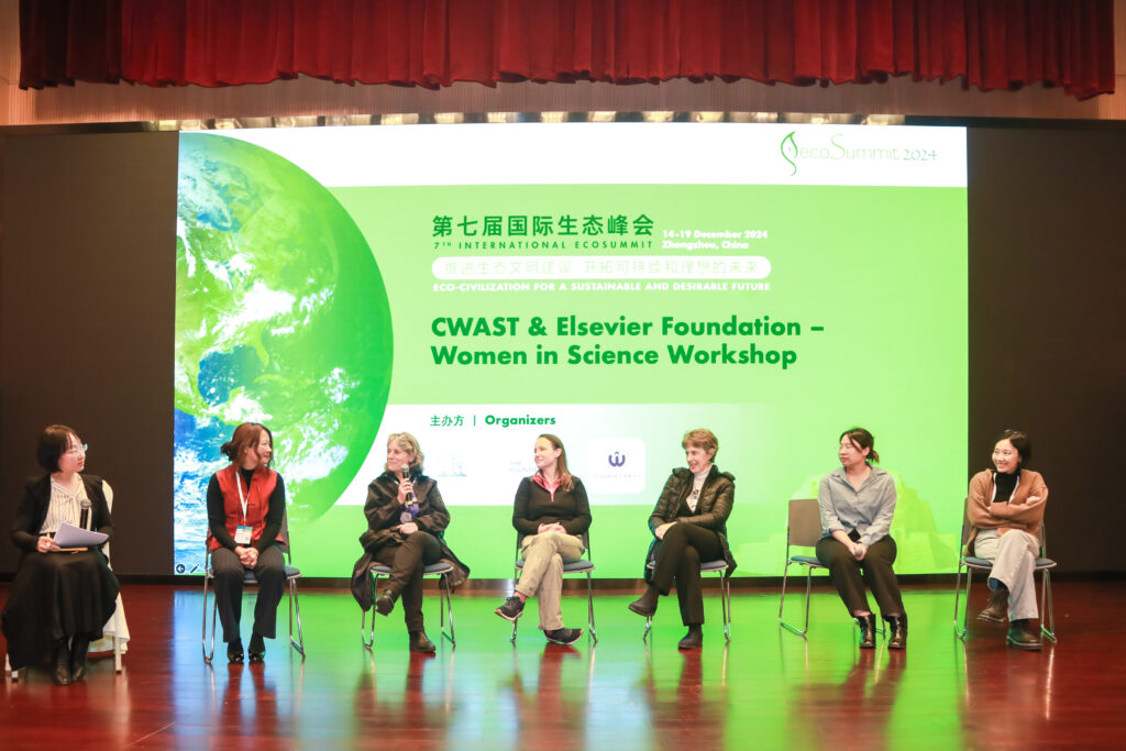 Panel of seven women seated on stage during the CWAST and Elsevier Foundation Women in Science Workshop at the 7th International EcoSummit 2024.